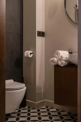 a bathroom with a toilet and a sink at Kaunas Old Town Art Deco Apartments I in Kaunas