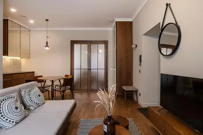 a living room with a couch and a table at Kaunas Old Town Art Deco Apartments I in Kaunas