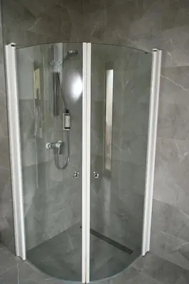 a shower with a glass door in a bathroom at Domus Revado in Birštonas