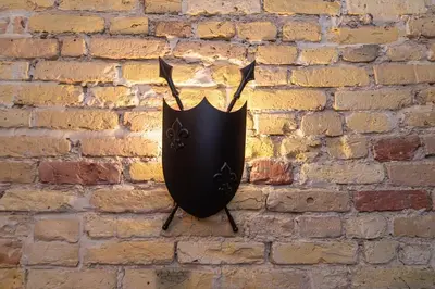 a black umbrella hanging on a brick wall at Old Town Apartments Senora Self Check-in and free parking in Vilnius