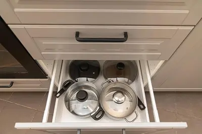 an open cabinet in a kitchen with two machines at Old Town Apartments Senora Self Check-in and free parking in Vilnius