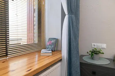 a window sill with a book and a book at Old Town Apartments Senora Self Check-in and free parking in Vilnius