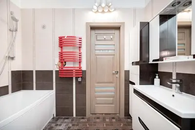 a bathroom with a tub and a toilet and a sink at Cathedral Square Apartment in Vilnius