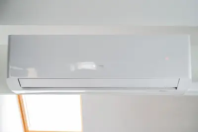 a white tv sitting on top of a table at Cathedral Square Apartment in Vilnius