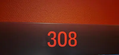 a close up of a clock with the number at Private room at Hotel building in Vilnius
