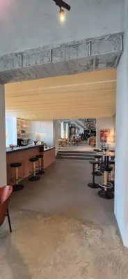 a large room with tables and chairs in a building at Private room at Hotel building in Vilnius