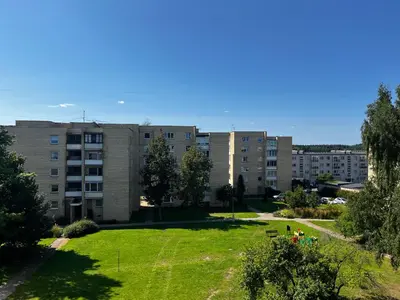 a park in front of an apartment building at Letastay in Trakai