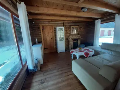 a living room with a couch and a table at A&S Vidugiris in Jurbarkas