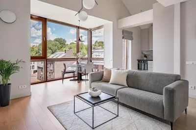 a living room with a couch and a table at Spacious 2 bedroom Luxury Apartment in Vilnius