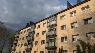 a large brick building with many windows on it at Kaunas River-View Retreat Free Parking in Kaunas