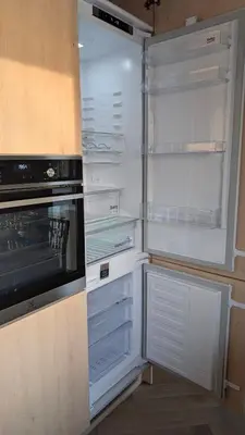an empty refrigerator with its door open in a kitchen at Kaunas River-View Retreat Free Parking in Kaunas