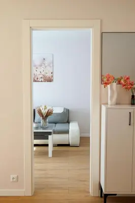 a living room with a couch and a table at Gero laiko oazė in Visaginas