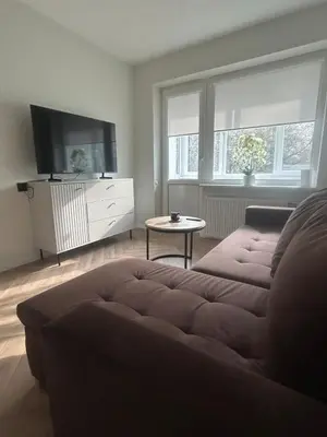 a living room with a couch and a table at Kolibris in Kaunas