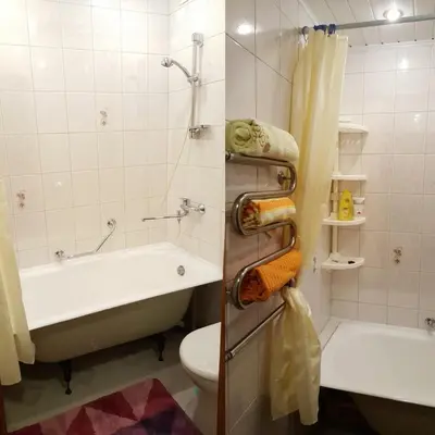 a bathroom with a tub and a toilet and a sink at Comfy Bright Apt in OLD TOWN Your Perfect Location in Vilnius