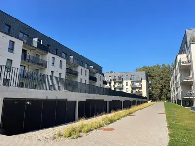 a row of apartment buildings on a street at Lazdyneliu Vingis Vilnius 