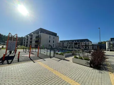 an empty park with a playground in a city at Lazdyneliu Vingis Vilnius 