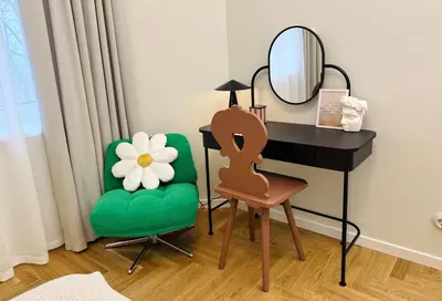 a dressing table and a chair with a mirror and a desk at Cosy hill in Kaunas