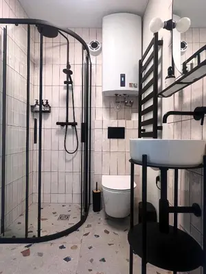 a bathroom with a shower and a sink and a toilet at Cosy hill in Kaunas