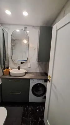 a bathroom with a sink and a mirror at Vilnius Apartment in Vilnius
