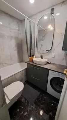 a bathroom with a sink toilet and a mirror at Vilnius Apartment in Vilnius