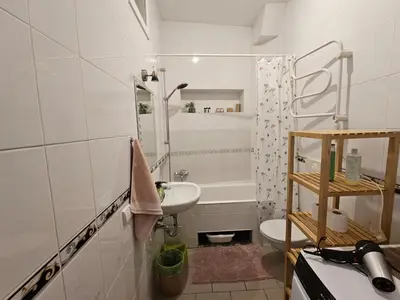 a bathroom with a sink and a toilet and a shower at Mykoliukas in Vilnius