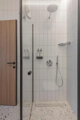 a shower with a glass door in a bathroom at LAJOS Hotel in Birštonas