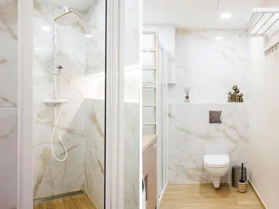 a bathroom with a toilet and a shower at Modernus butas prie EŽERO in Vilnius