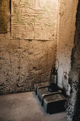 a lamp sitting on a block in a room at Pinčiukas Bunkeris in Dagiai