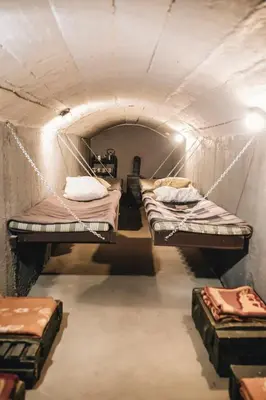 a small room with two bunk beds in it at Pinčiukas Bunkeris in Dagiai