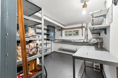 a room with bunk beds and a table in it at Ramybes Oaze, Nauji stylingi apartamentai in Panevėžys