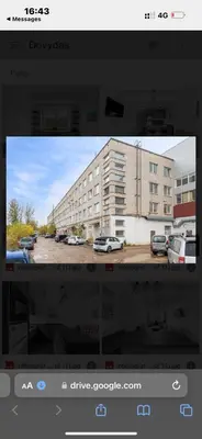 a television screen with a picture of a building at Flat-studija in Vilnius