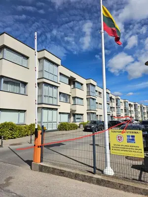 a flag on a pole in front of a building at 3 rooms 3 beds apartment with garden in Kaunas