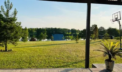 a view of a field with a basketball hoop at Bijunai in Žaugėdai