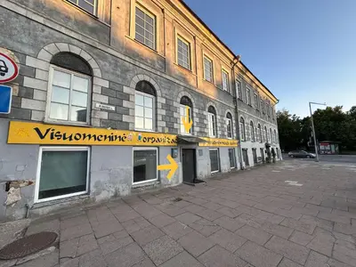 a building with a sign on the side of it at Gate of Dawn by Kliefs Vilnius - Virtual Check-In in Vilnius