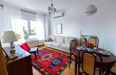 a living room with a couch and a table at Kalinovs Stay Apartment in Adutiškis