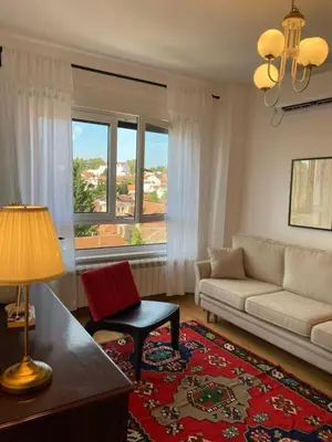 a living room with a couch and a window at Kalinovs Stay Apartment in Adutiškis