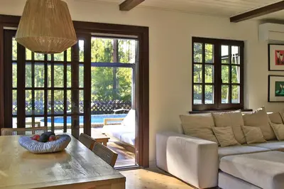 a living room with a couch and a table at Secluded private villa in the middle of the woods in Margionys