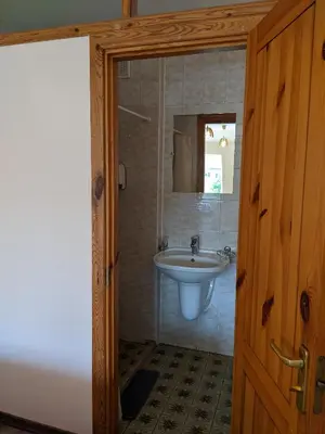 a bathroom with a sink and a mirror at Guest House Kamara in Panevėžys