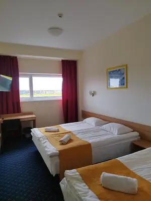 a hotel room with two beds and a window at ----------------------------- Via Baltica Panevezys in Panevėžys