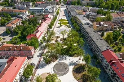 an aerial view of a city with a train at ----------------------------- Via Baltica Panevezys in Panevėžys
