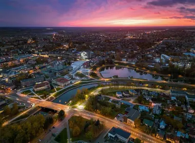 an aerial view of a city at night at ----------------------------- Via Baltica Panevezys in Panevėžys