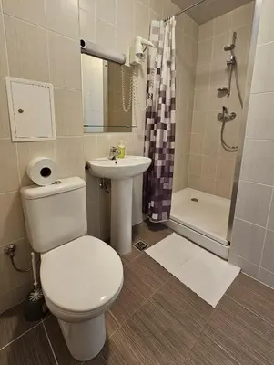 a bathroom with a toilet and a sink and a shower at ----------------------------- Via Baltica Panevezys in Panevėžys