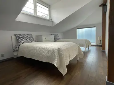 a bedroom with two beds and a window at newTown in Kaunas