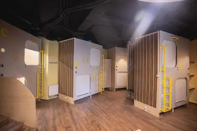 a room with a bunch of white storage units at Hostel K3a in Vilnius