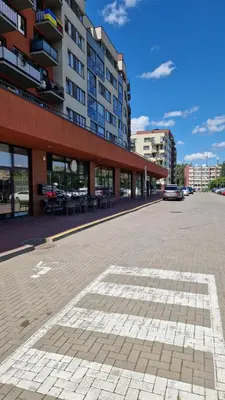 an empty parking lot in front of a building at Vilnius Lazdynėliai in Pakopi