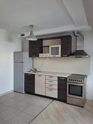 a kitchen with a stove and a refrigerator at Cozy Studio in Vilnius Old Town in Vilnius