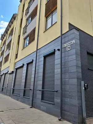 a building with a street sign on the side of it at Cozy Studio in Vilnius Old Town in Vilnius