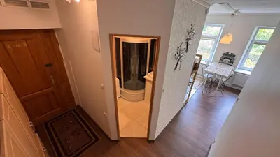 a hallway with a walk in shower in a home at Cozy stay Vilnius in Vilnius