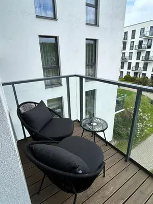 a balcony with two chairs and a table at Flat in central of Vilnius in Vilnius