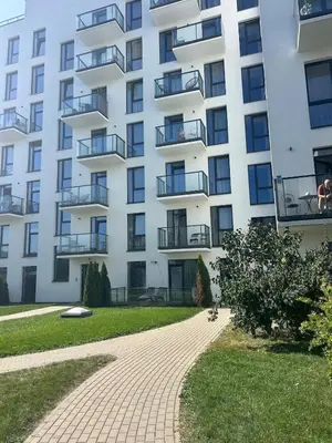 a building with a brick walkway in front of it at Flat in central of Vilnius in Vilnius